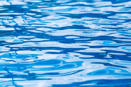 expanse of blue water in the pool as a backgroundの写真素材