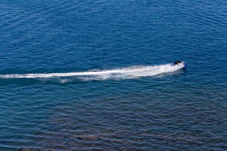jet ski on the surface of the water at a speed ofの写真素材