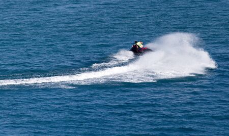 jet ski on the surface of the water at a speed ofの写真素材