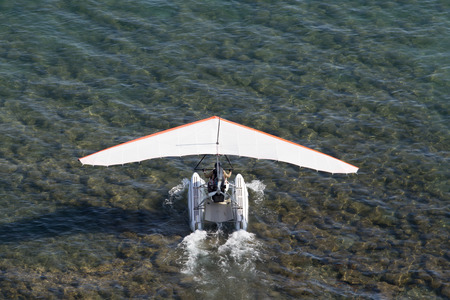 plane takes off from the surface of the water
