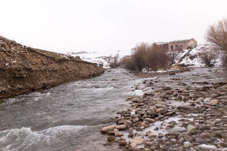 mountain river in the winter in natureの写真素材