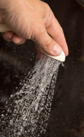 Water from the shower in your handの写真素材