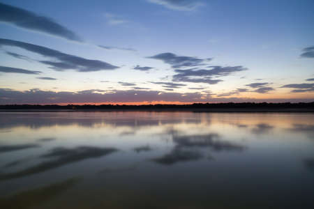 a beautiful sunset on the lakeの写真素材