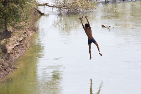 man on the bungee on the riverの写真素材