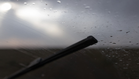 raindrops on a windshield of carの写真素材