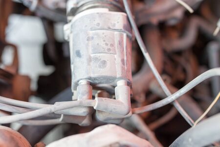 motor and hoses under the hood of carの写真素材