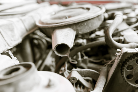 motor and hoses under the hood of carの写真素材