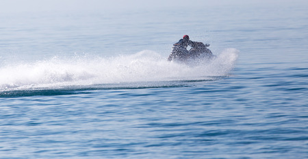 jet ski on the surface of the water at a speed ofの写真素材