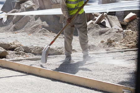 workers dub road sand and gravel