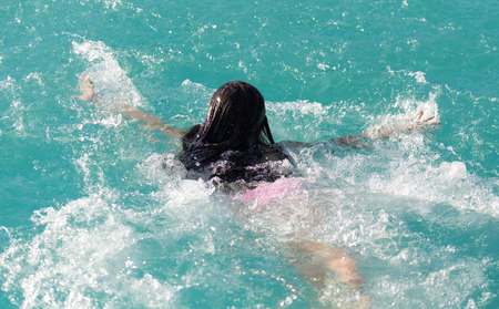 girl bathes in the water parkの写真素材