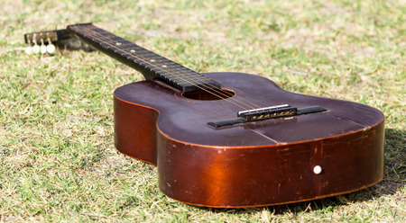 Guitar lying on the grass on the natureの写真素材