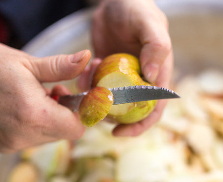 cutting an apple with a knifeの写真素材