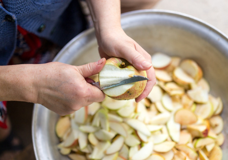 cutting an apple with a knifeの写真素材