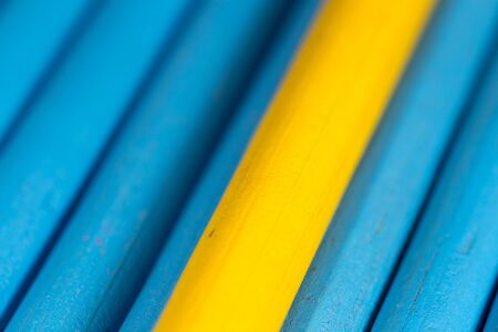 yellow and blue pencils as backgroundの写真素材
