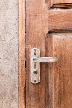 Handle on the old wooden doorの写真素材