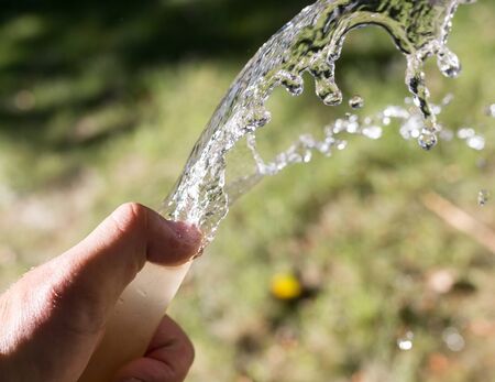 water from the hose outdoors