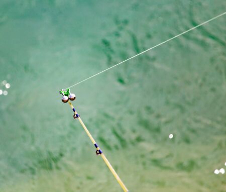 rod on background surface of the waterの写真素材