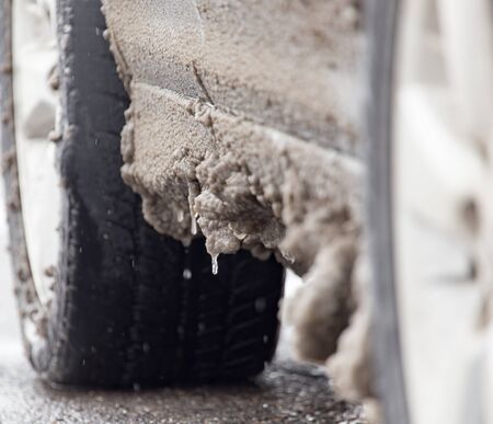 snow and icicles on cars in winterの写真素材