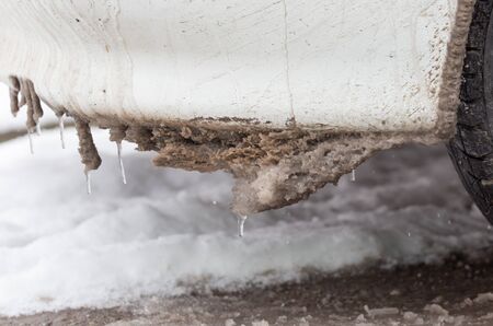 snow and icicles on cars in winterの写真素材