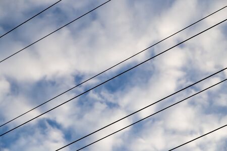 electrical wires on the dawn of the sunの写真素材