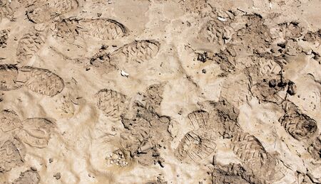 traces of the shoe on the ground as a backgroundの写真素材