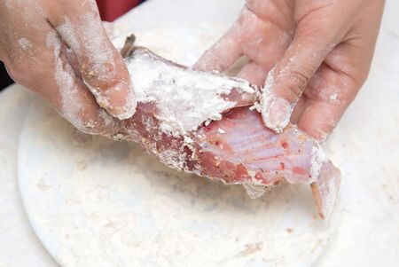 fish pieces in flourの写真素材