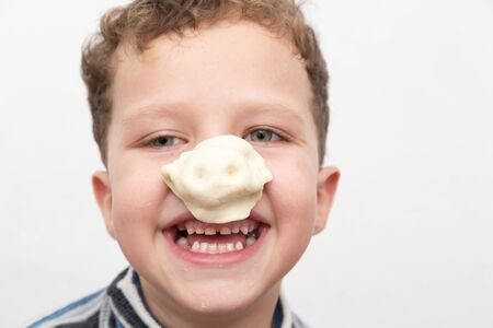 boy with a test on the nose