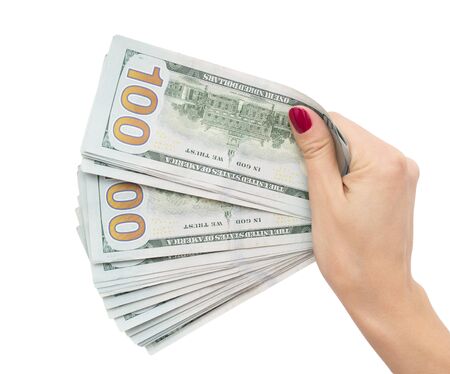 dollars in the hand of the girl on a white backgroundの写真素材