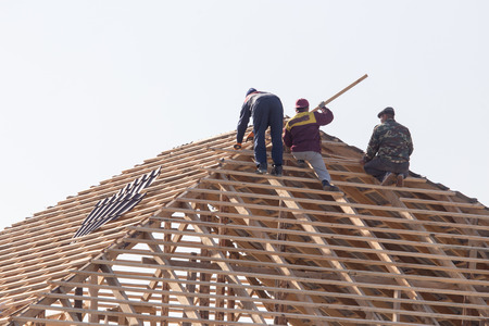 workers working on the roofの写真素材