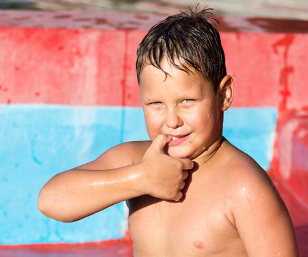 Boy swims in the water parkの写真素材