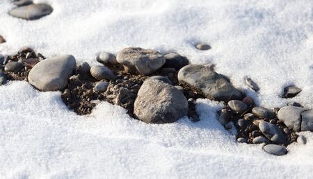 Snow on the rocksの写真素材