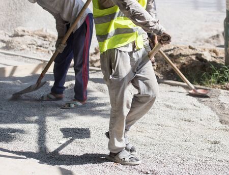 workers dub road sand and gravelの写真素材