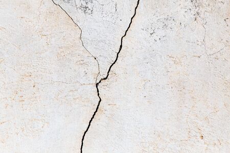 cracked white wall as a backgroundの写真素材