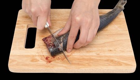 preparation of herring on a board on a black background