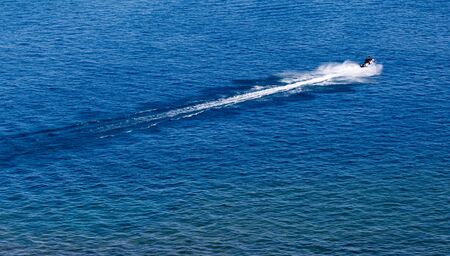 jet ski on the surface of the water at a speed ofの写真素材