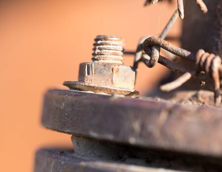 rusty bolt on a pipeの写真素材