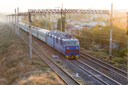 train on the railway at sunset