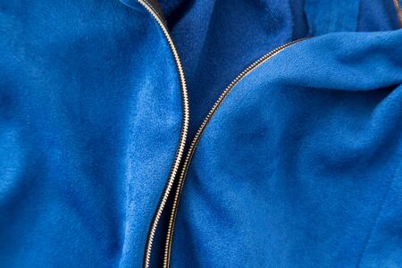 lock on blue fabric as a backgroundの写真素材
