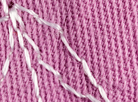 pink fabric as a background. macro