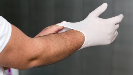 dentist puts gloves