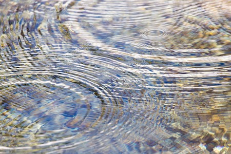 circles on the water surface as a backgroundの写真素材