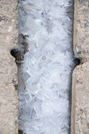 winter ice on the ground as a backgroundの写真素材