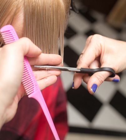 Female haircut with scissorsの写真素材
