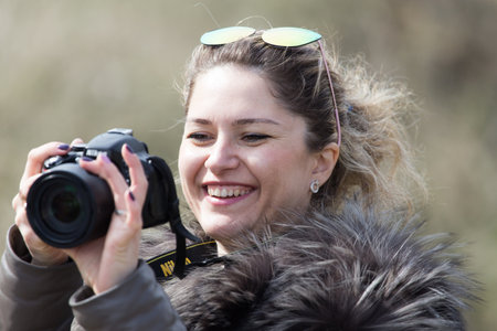 Shymkent, KAZAKHSTAN - February 26, 2017: Photographer on Russian holiday Maslenitsaのeditorial素材