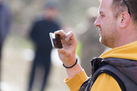 Shymkent, KAZAKHSTAN - February 26, 2017: Photographer on Russian holiday Maslenitsaのeditorial素材