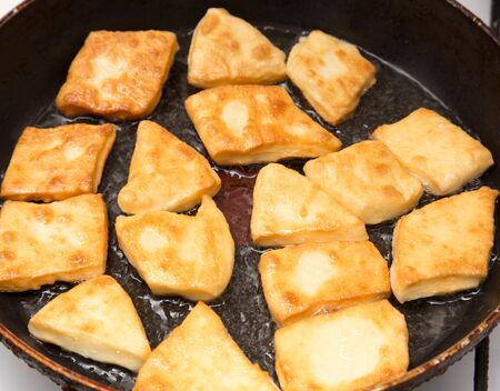 donuts fried in a panの写真素材