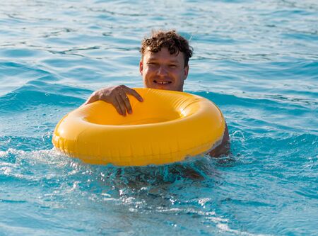 The man is swimming in the poolの写真素材