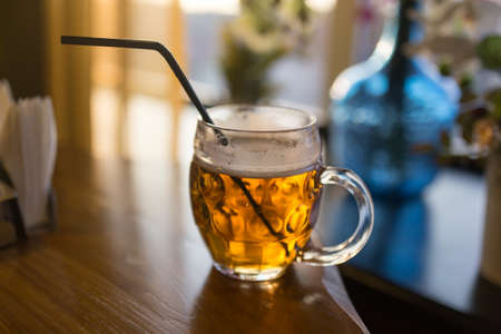 A beer mug in a restaurantの写真素材