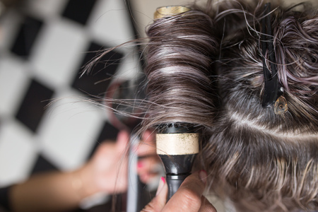 Styling female hair dryerの写真素材