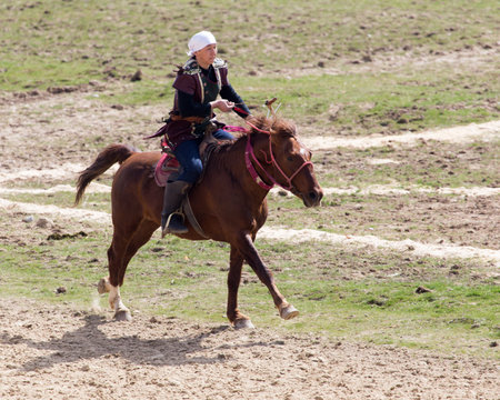 Shymkent, KAZAKHSTAN - 22 March 2017: Celebration of the Kazakh holiday NARIYZ. Archery from a horseのeditorial素材